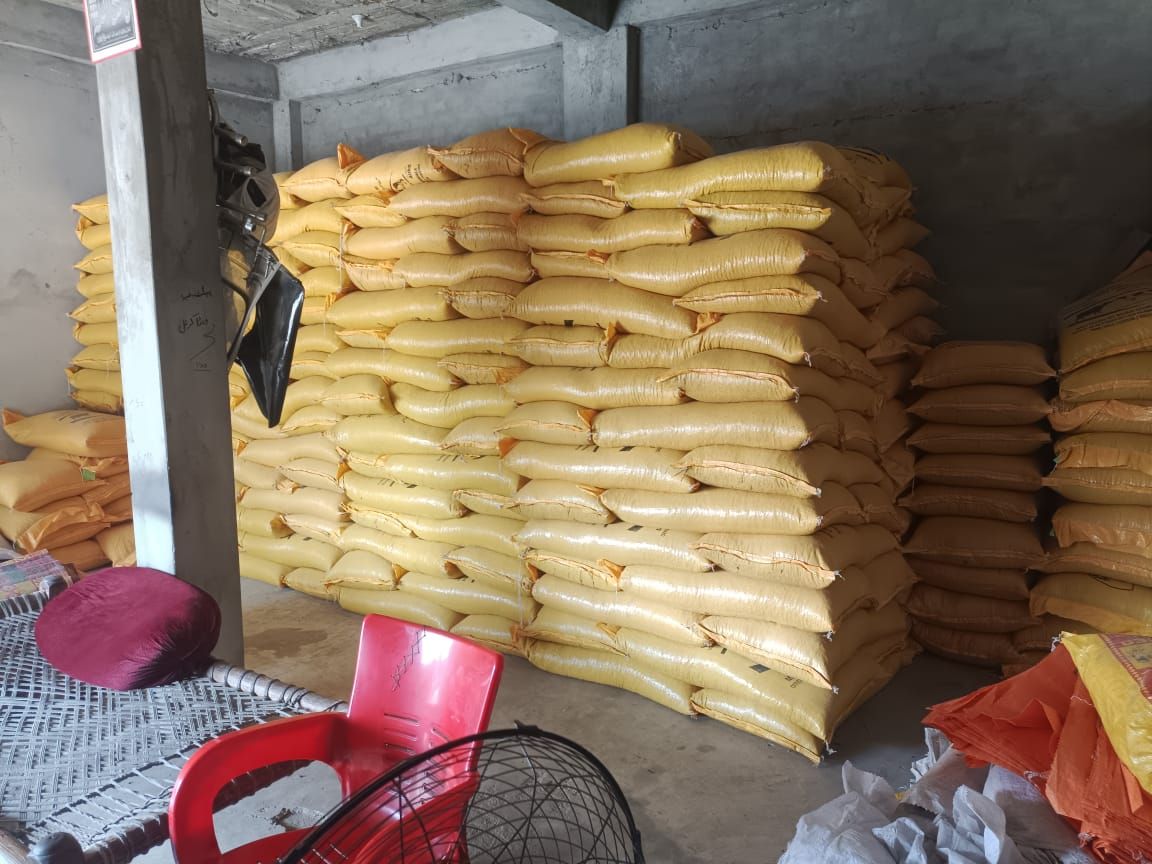 Warehouse stacked with MM Feeds bags ready for dispatch